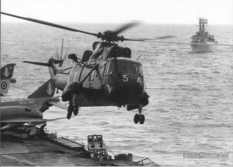 Sea-King-with-HMS-Hampshire-in-background